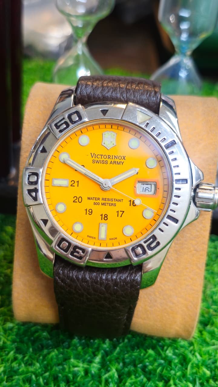 WhatsApp Image 2026-07-10 at 9.58.28 AM Victorinox Swiss Army Dive 500M Watch — Yellow Dial Quartz Movement Switzerland 🇨🇭 made Men's watch (Used) - Image 1