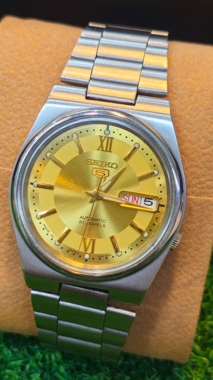 WhatsApp Image 2026-07-20 at 12.57.48 PM Vintage Seiko 5 Automatic — Gold Roman Numeral Dial, Day-Date, Ref. 7S26-06N2 caliber 21-jewels japan made watch (Used) - Image 1