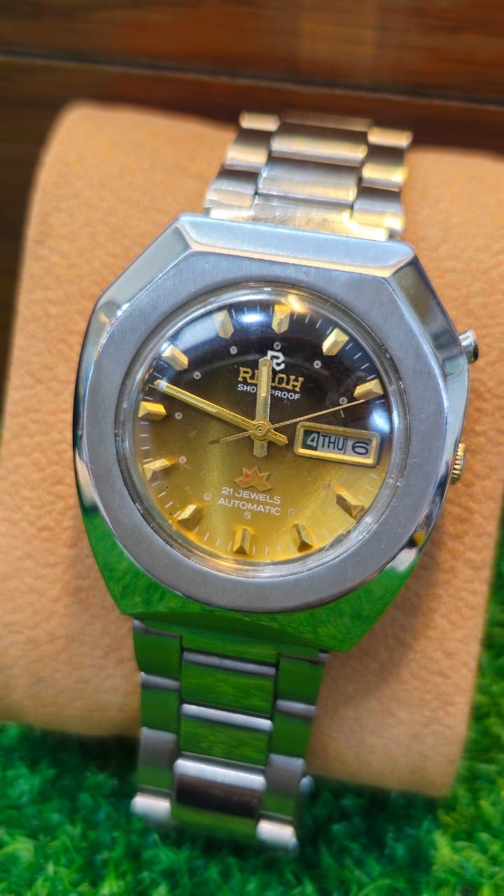 WhatsApp Image 2026-08-06 at 12.03.59 PM ✨🇯🇵 Vintage Ricoh 21-Jewels Automatic Day-Date – 1970s | Sunburst Olive Green Dial | Japan Made Men's watch (Used) - Image 1
