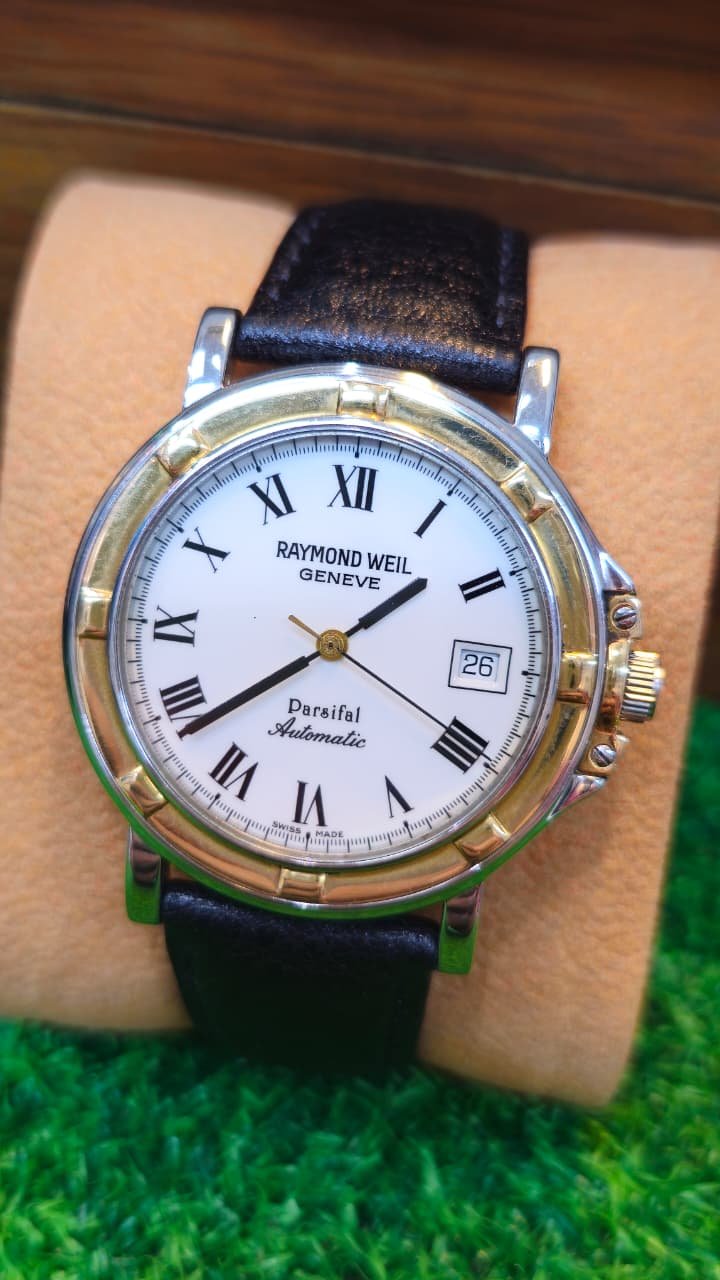 WhatsApp Image 2026-08-13 at 4.37.15 PM (1) ⌚ RAYMOND WEIL PARSIFAL – SWISS AUTOMATIC – TWO-TONE – SAPPHIRE CRYSTAL (Used) - Image 1